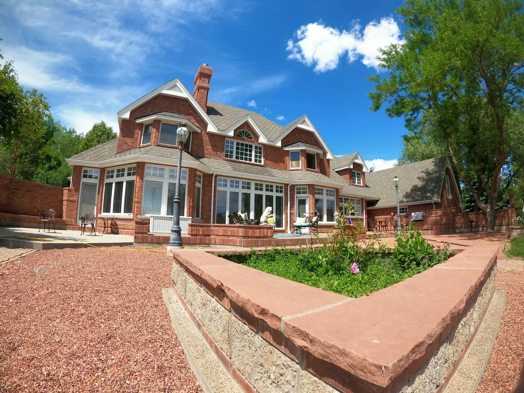 Large brick home with freshly cleaned windows