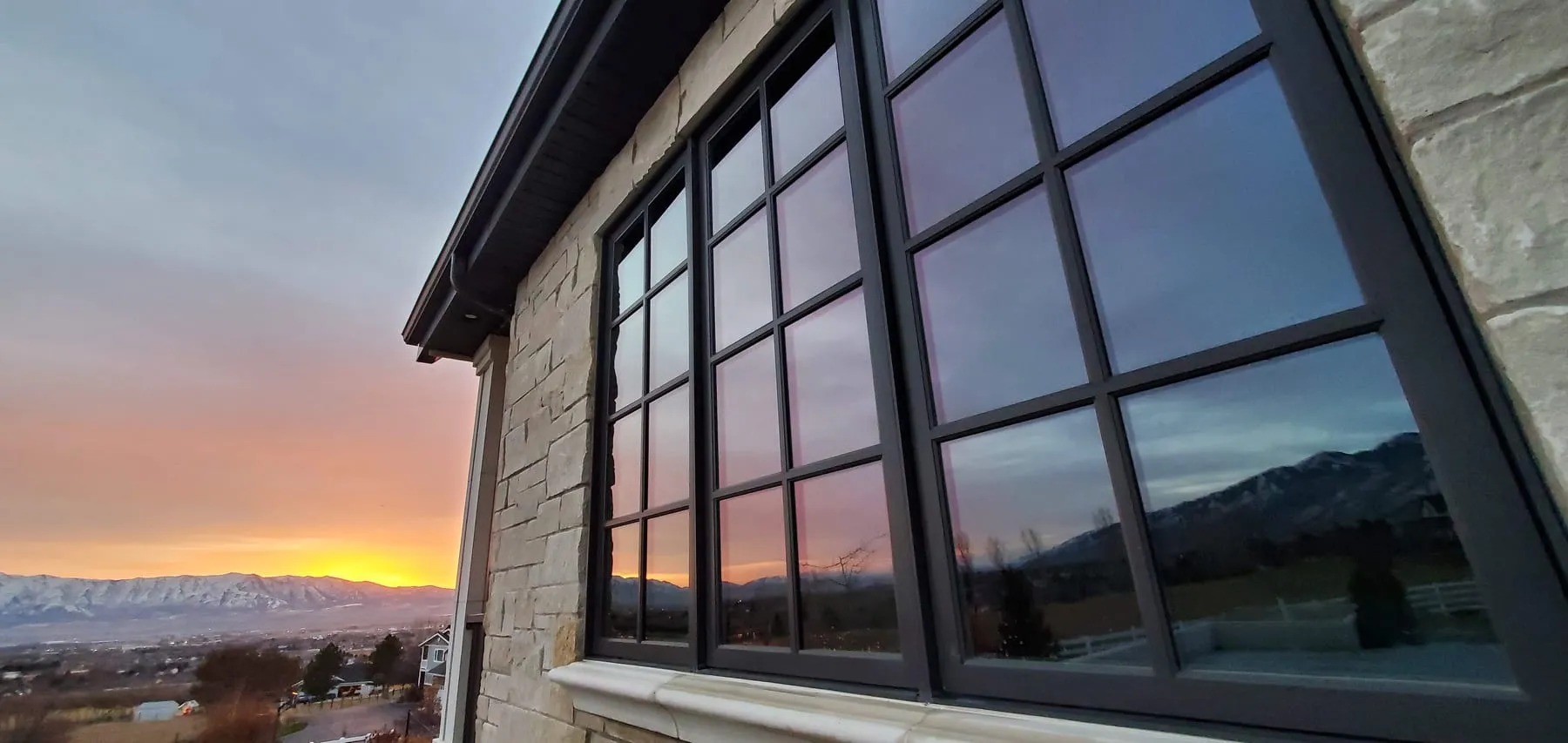 Clean windows reflecting a Cache Valley sunset